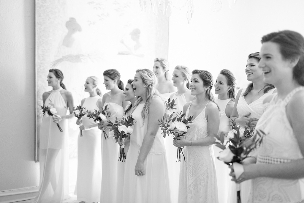 My gorgeous bridesmaids watching as I came down the stairs; they looked like angels! I wanted their garden rose bouquets to look as though they had been gathered from the garden that morning.