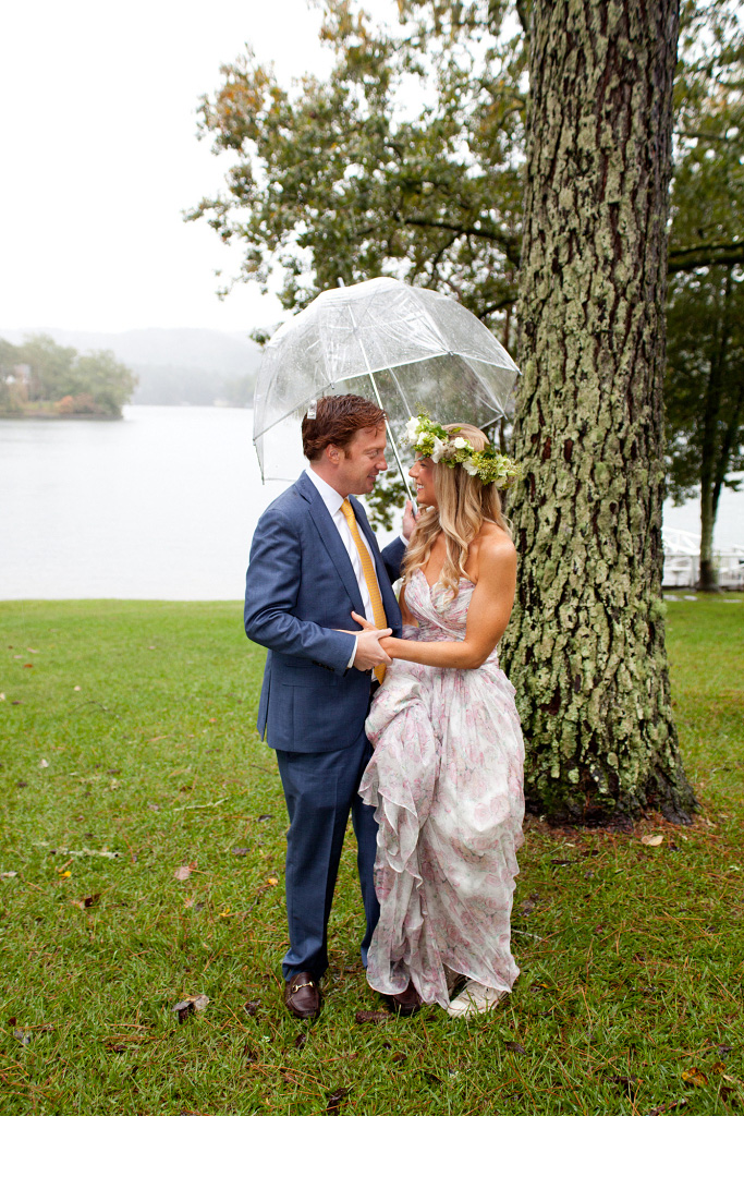Christy Maddox and Rob Haile smiling in the rain